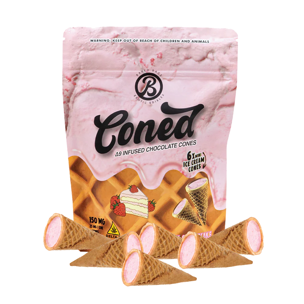 Mini coned strawberry shortcake edible cone with pink crumble and creamy filling